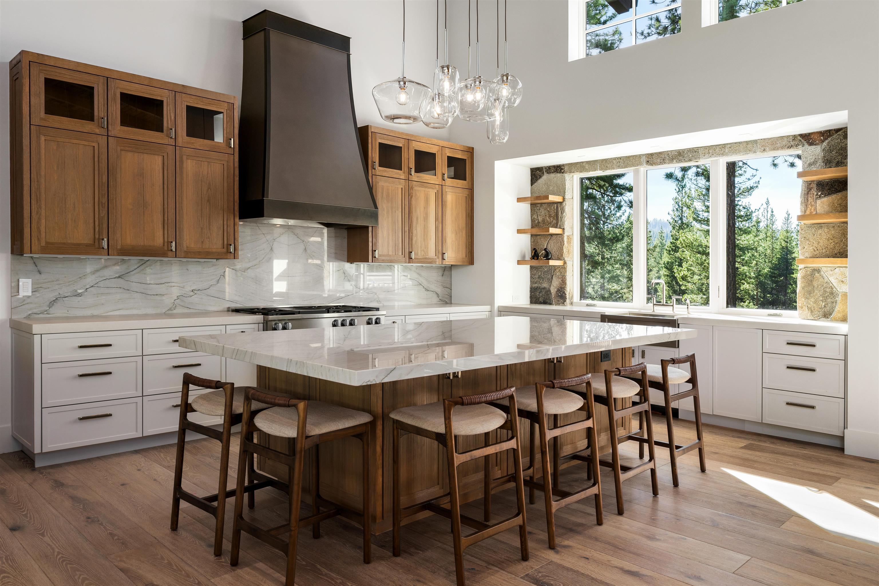 8207 Ehrman Drive Truckee, CA 96161 - Photo 4 of 21 a kitchen with a table chairs sink and cabinets