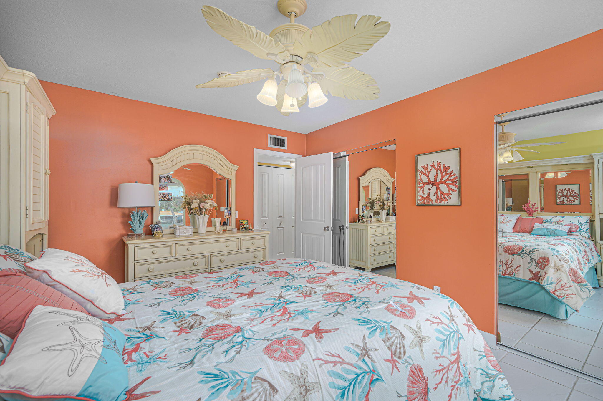 1351 Bayshore Drive, Unit 304 Fort Pierce, FL 34949 - Photo 11 of 25 a bedroom with a large bed and a chandelier