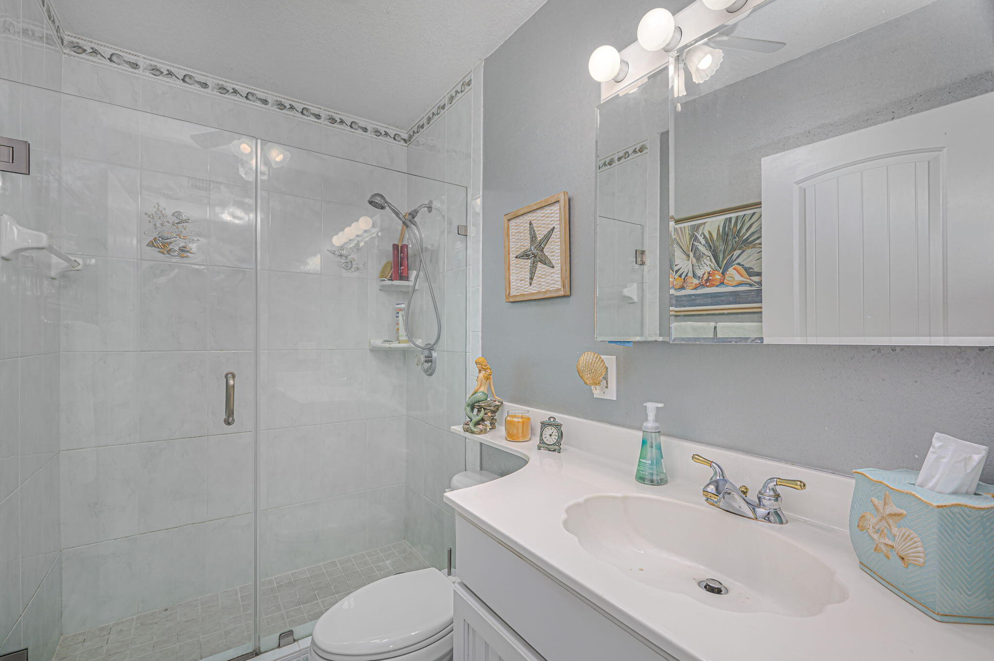 1351 Bayshore Drive, Unit 304 Fort Pierce, FL 34949 - Photo 13 of 25 a bathroom with a sink toilet and shower