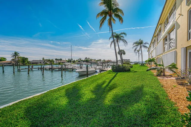 a view of a swimming pool with a table and chairs
