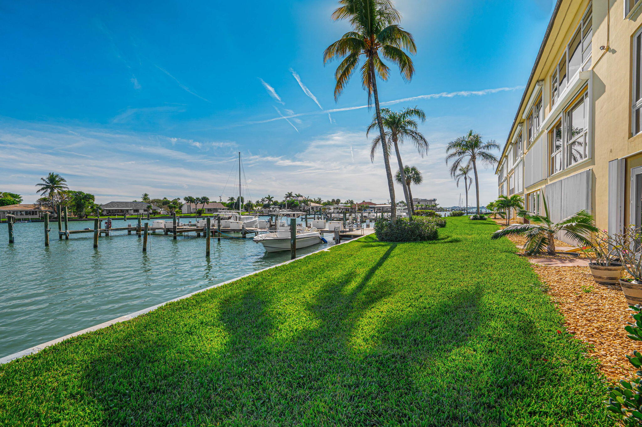 1351 Bayshore Drive, Unit 304 Fort Pierce, FL 34949 - Photo 14 of 25 a view of a swimming pool with a table and chairs