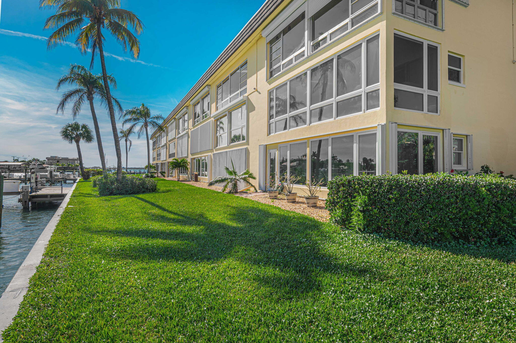 1351 Bayshore Drive, Unit 304 Fort Pierce, FL 34949 - Photo 15 of 25 a view of a building with a yard