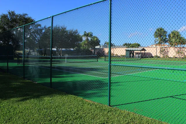 a view of a house and a big yard