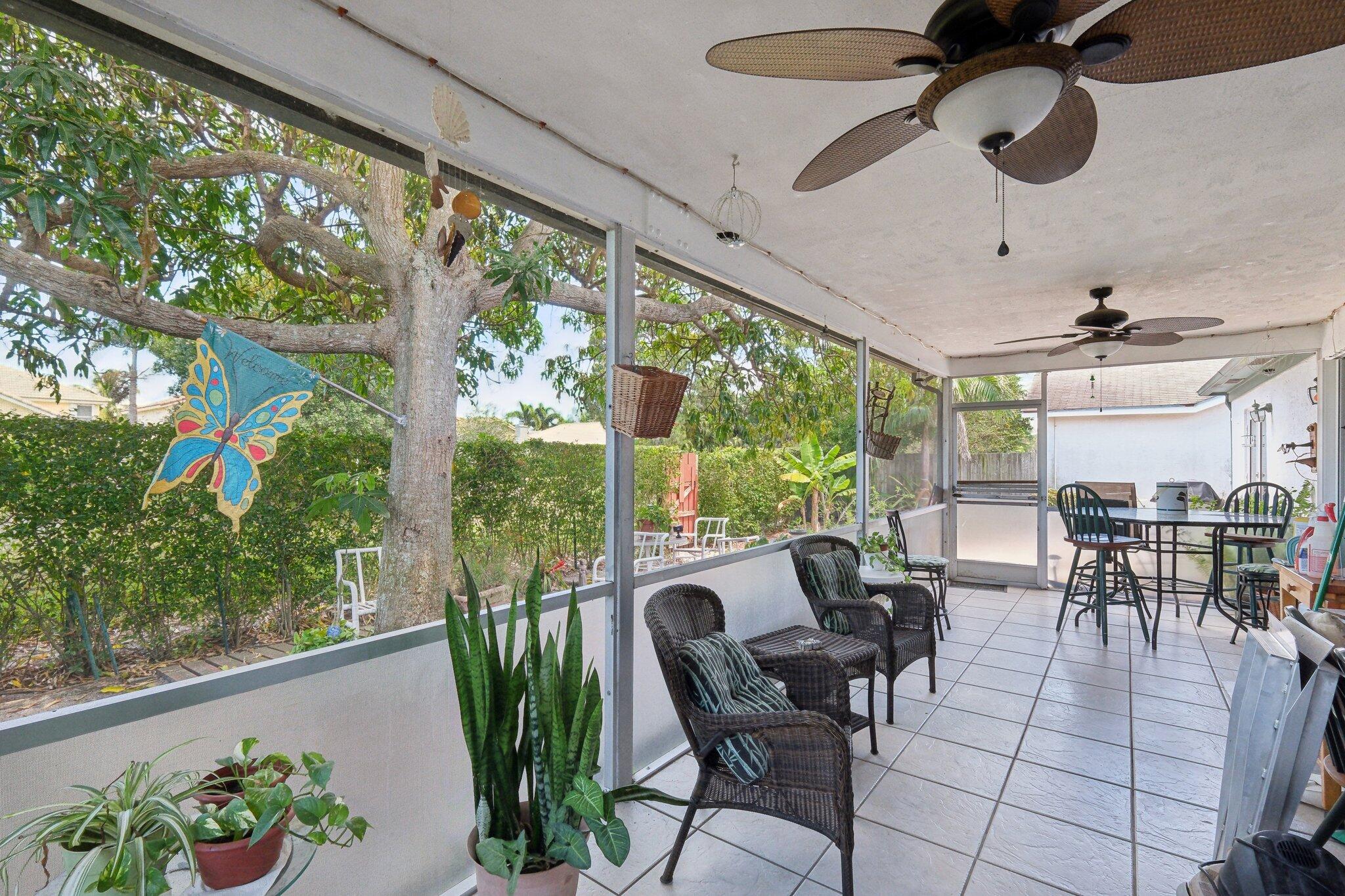 125 Wandering Trail, Unit TRL Jupiter, FL 33458 - Photo 19 of 22 a view of a dining room with furniture window and outside view