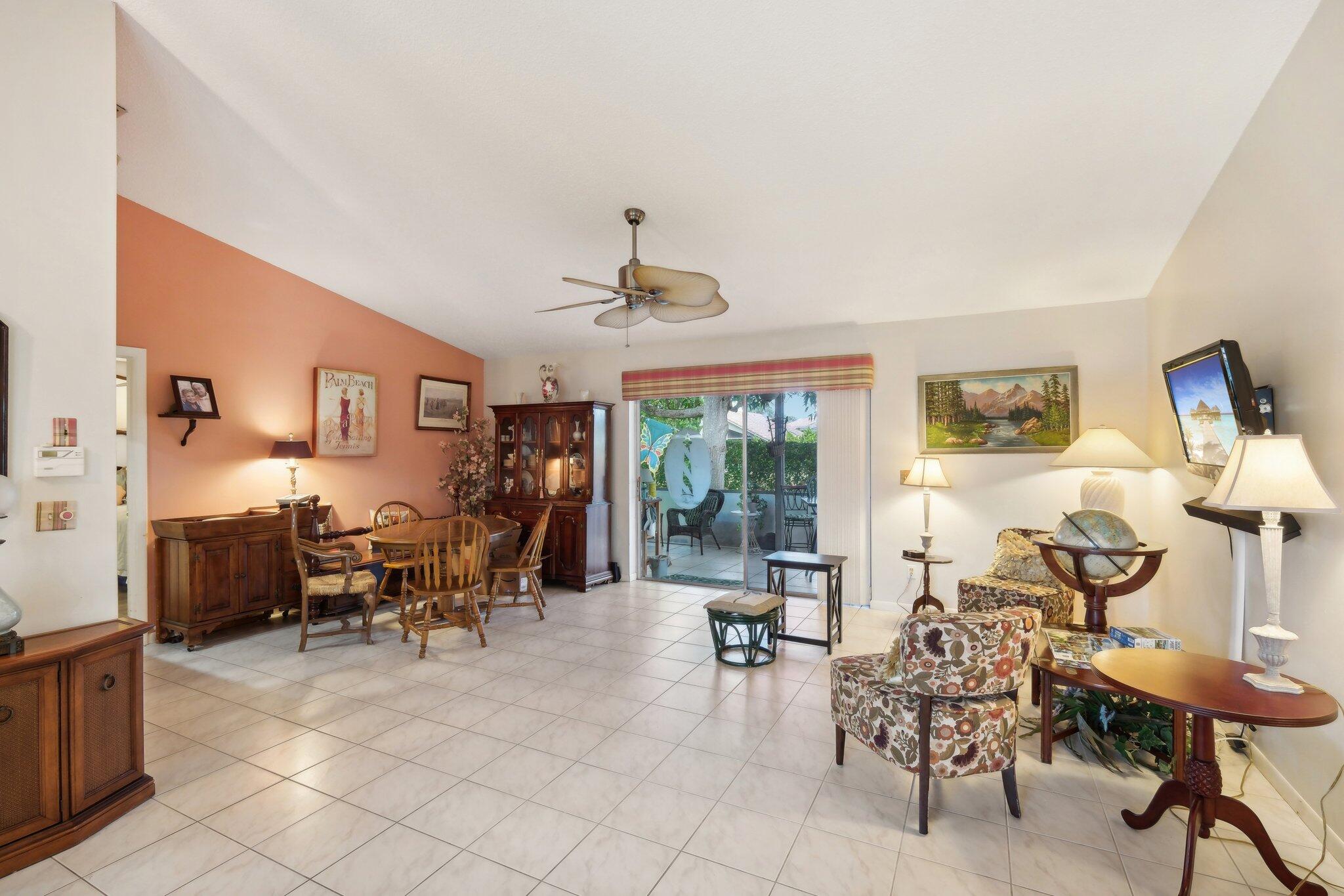 125 Wandering Trail, Unit TRL Jupiter, FL 33458 - Photo 9 of 22 a view of a livingroom with furniture and a window