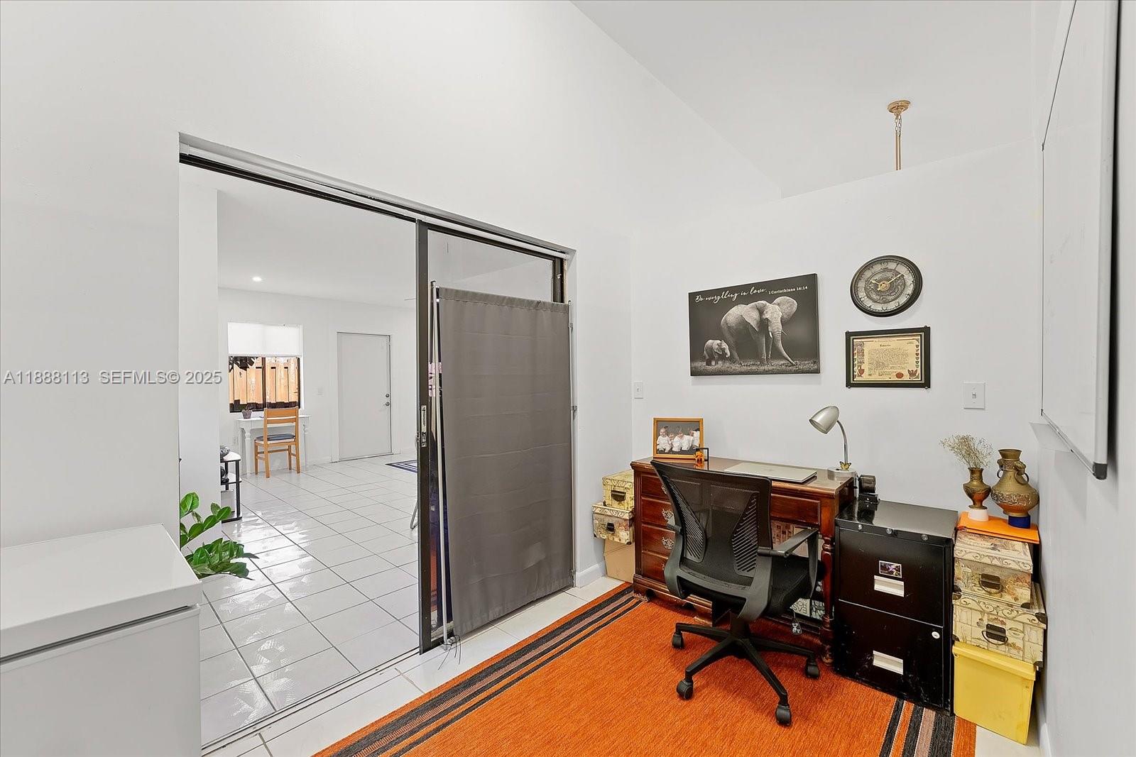 13556 Southwest 285th Terrace Homestead, FL 33033 - Photo 13 of 25 a room with furniture a rug and a clock