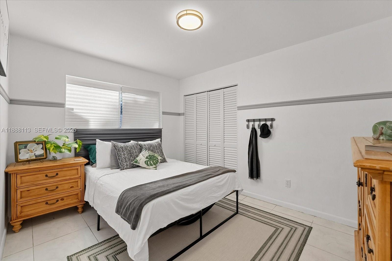 13556 Southwest 285th Terrace Homestead, FL 33033 - Photo 15 of 25 a bedroom with a bed and a dresser