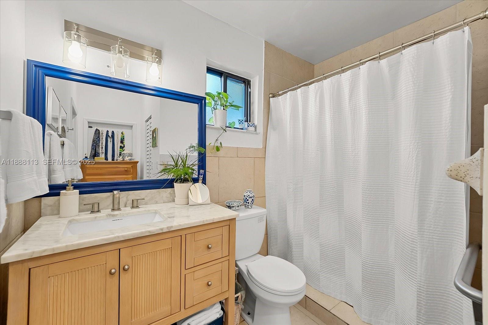 13556 Southwest 285th Terrace Homestead, FL 33033 - Photo 19 of 25 a bathroom with a granite countertop sink and a mirror