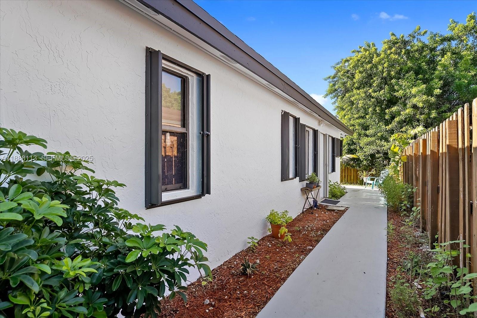 13556 Southwest 285th Terrace Homestead, FL 33033 - Photo 25 of 25 a front view of a house with garden
