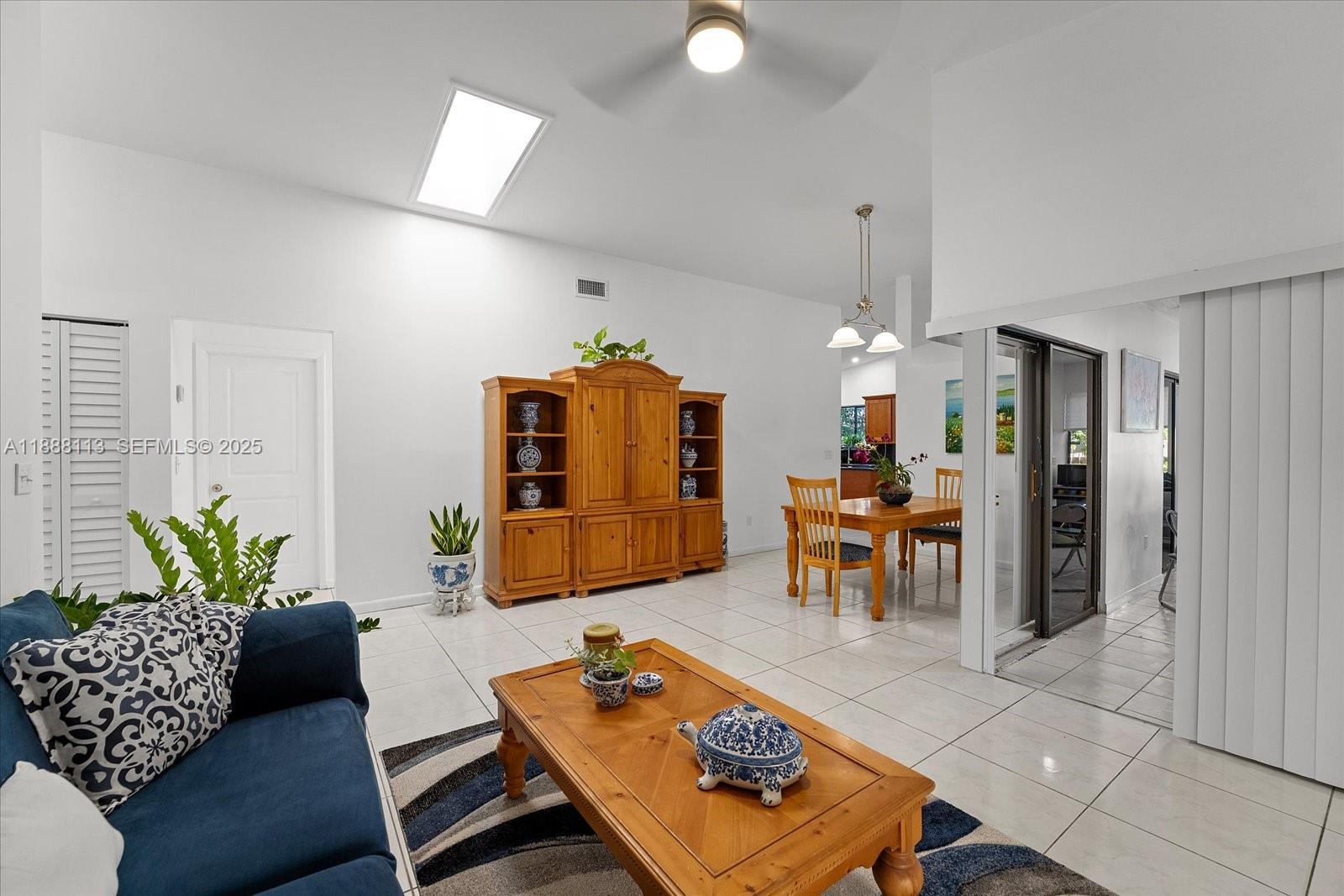 13556 Southwest 285th Terrace Homestead, FL 33033 - Photo 3 of 25 a living room with furniture and a dining table