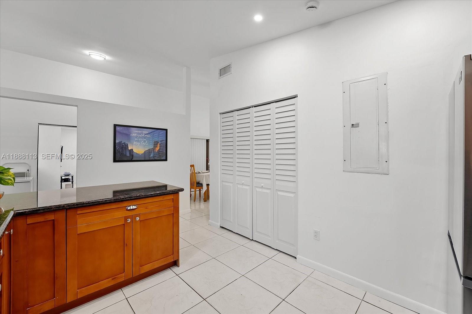 13556 Southwest 285th Terrace Homestead, FL 33033 - Photo 8 of 25 a hallway with a sink and a mirror