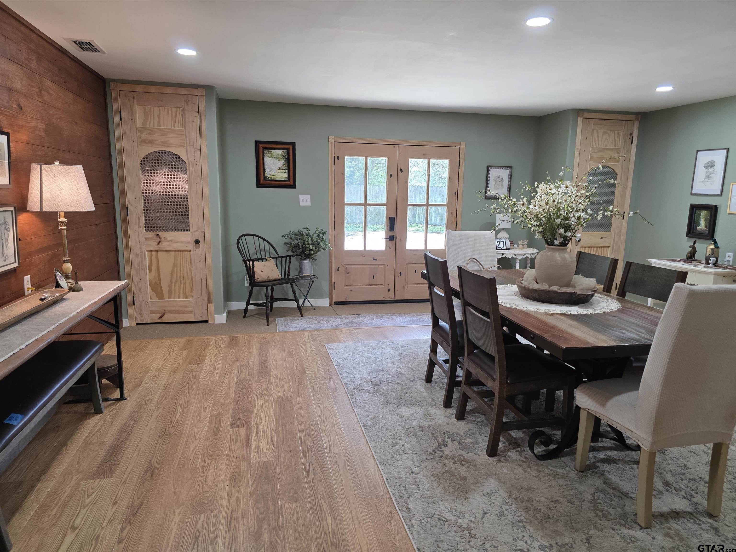 6170 Highway 271 Mount Pleasant, TX 75455 - Photo 8 of 43 a view of a dining room with furniture window and wooden floor
