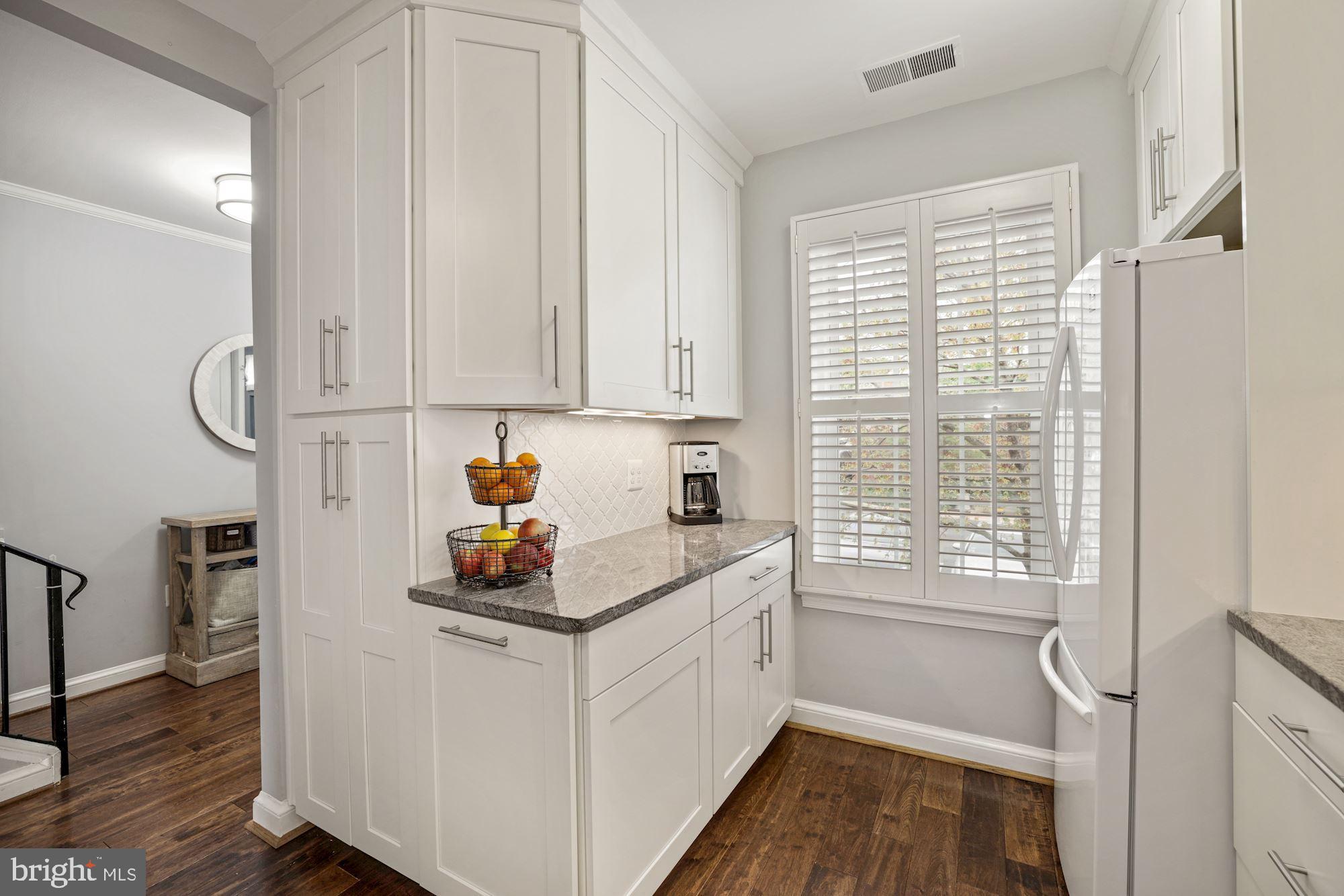1650 Beekman Place Northwest, Unit A Washington, DC 20009 - Photo 5 of 25 Stunningly renovated kitchen w/a window
