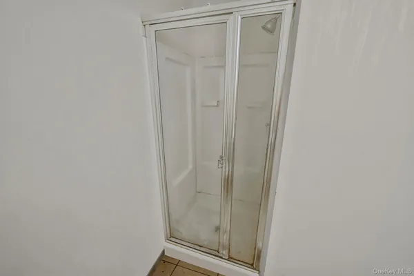 a bathroom with a glass door