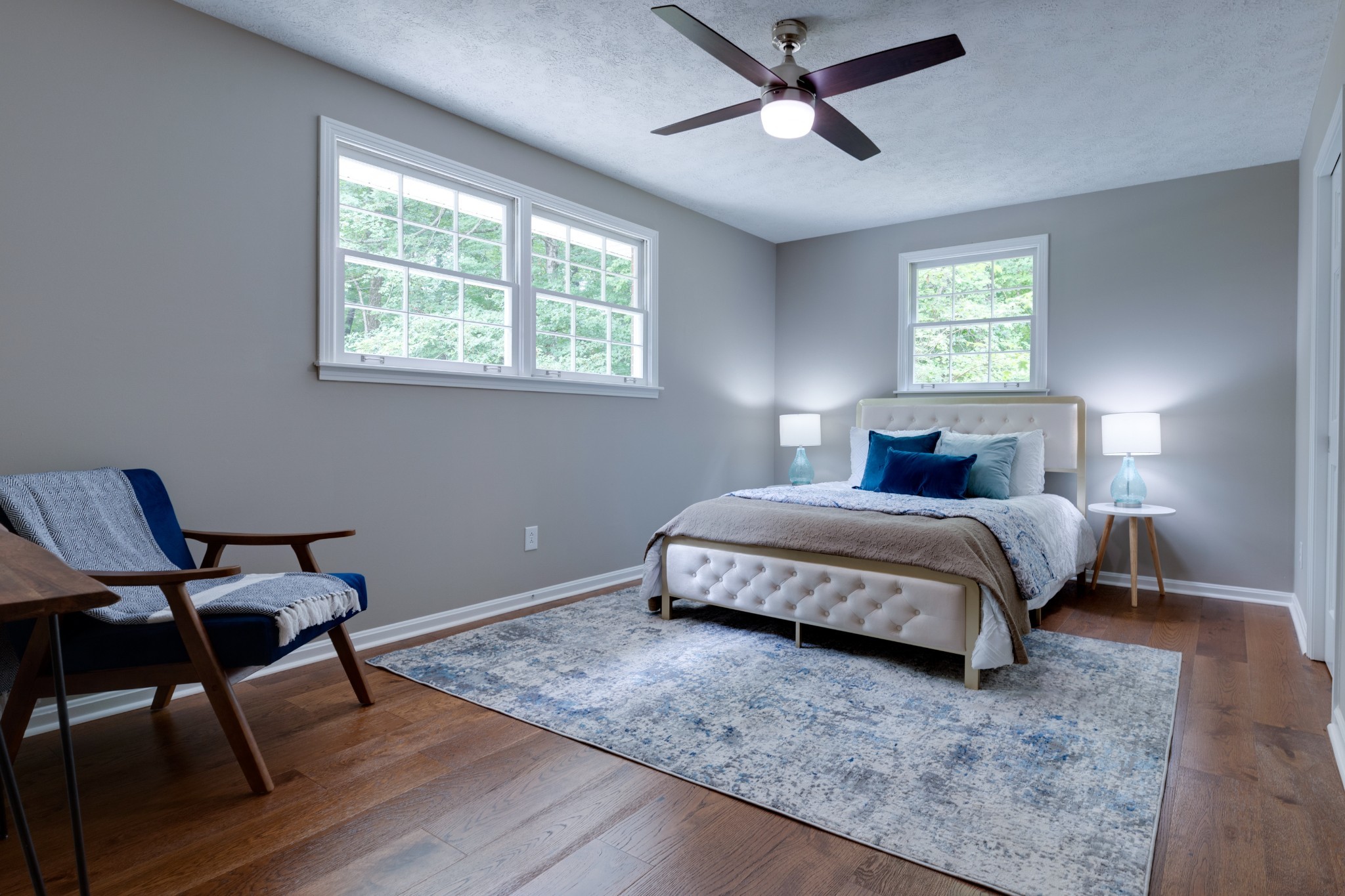 112 Lee Road Dickson, TN 37055 - Photo 16 of 39 a bedroom with a bed windows and chair