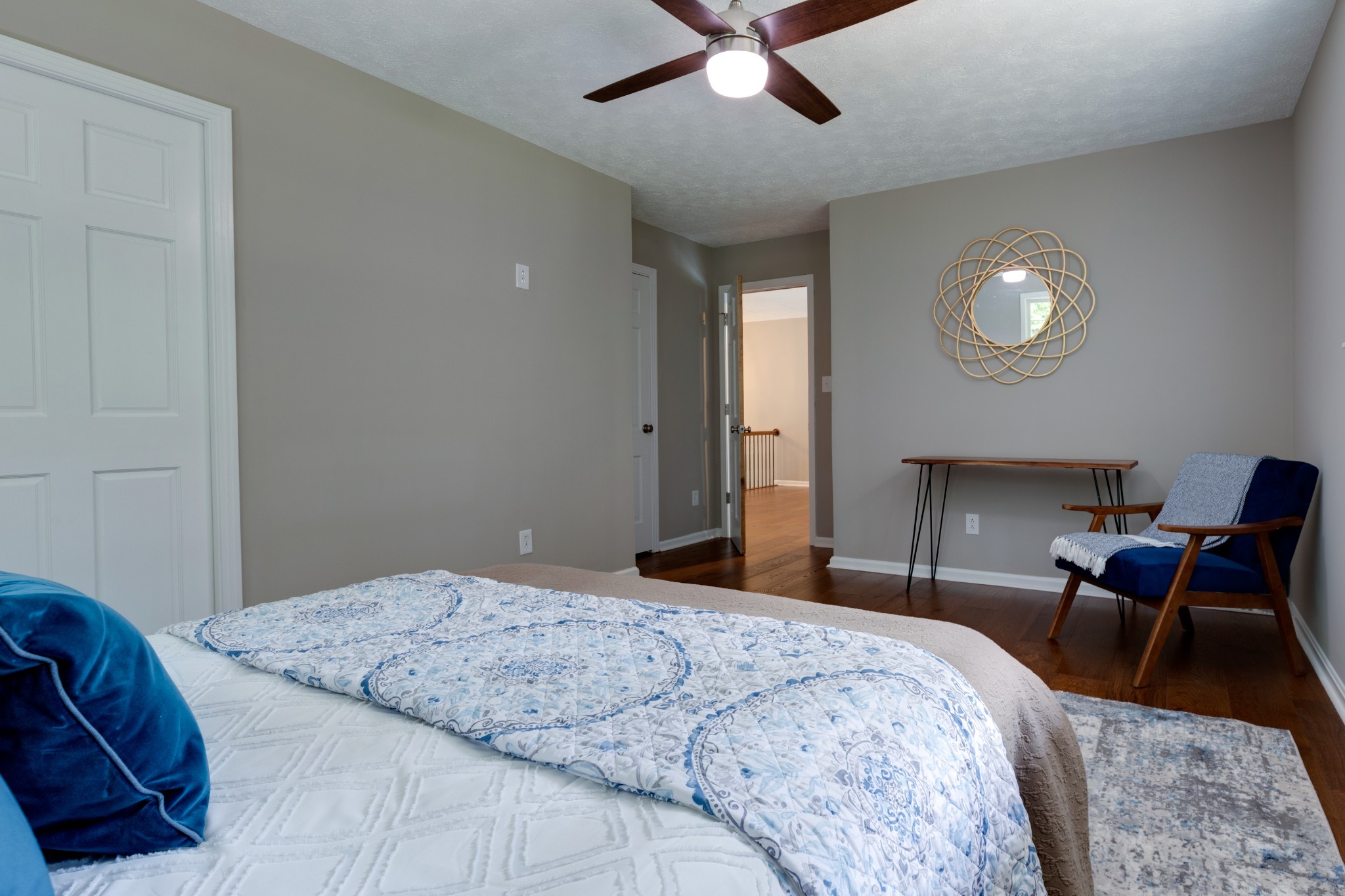 112 Lee Road Dickson, TN 37055 - Photo 17 of 39 a bedroom with a bed and a lamp on dresser