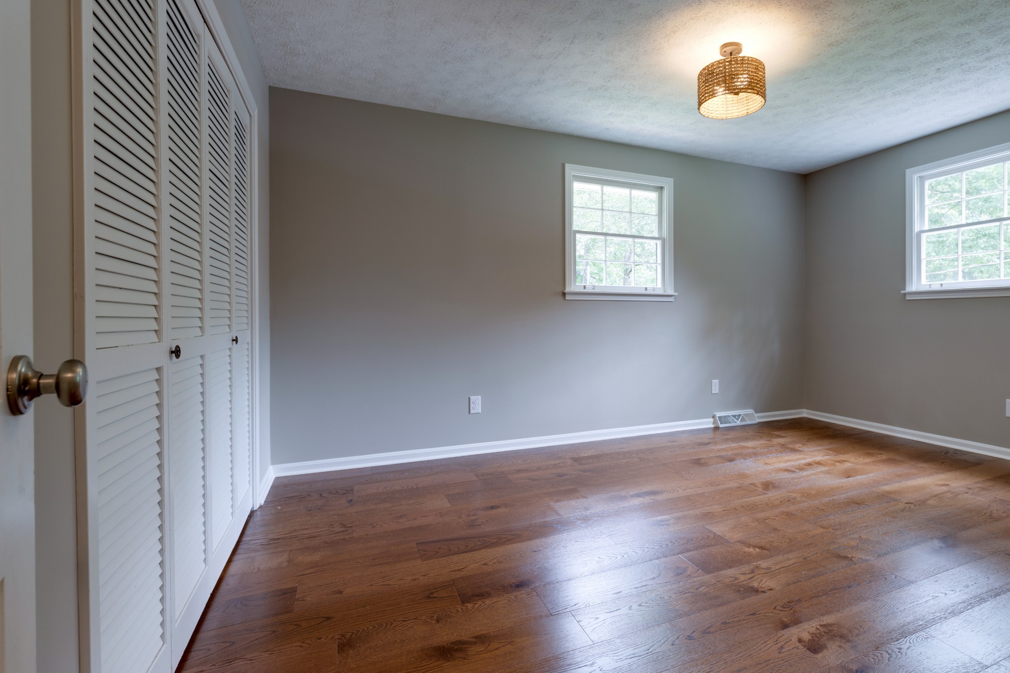 112 Lee Road Dickson, TN 37055 - Photo 21 of 39 an empty room with wooden floor chandelier and windows