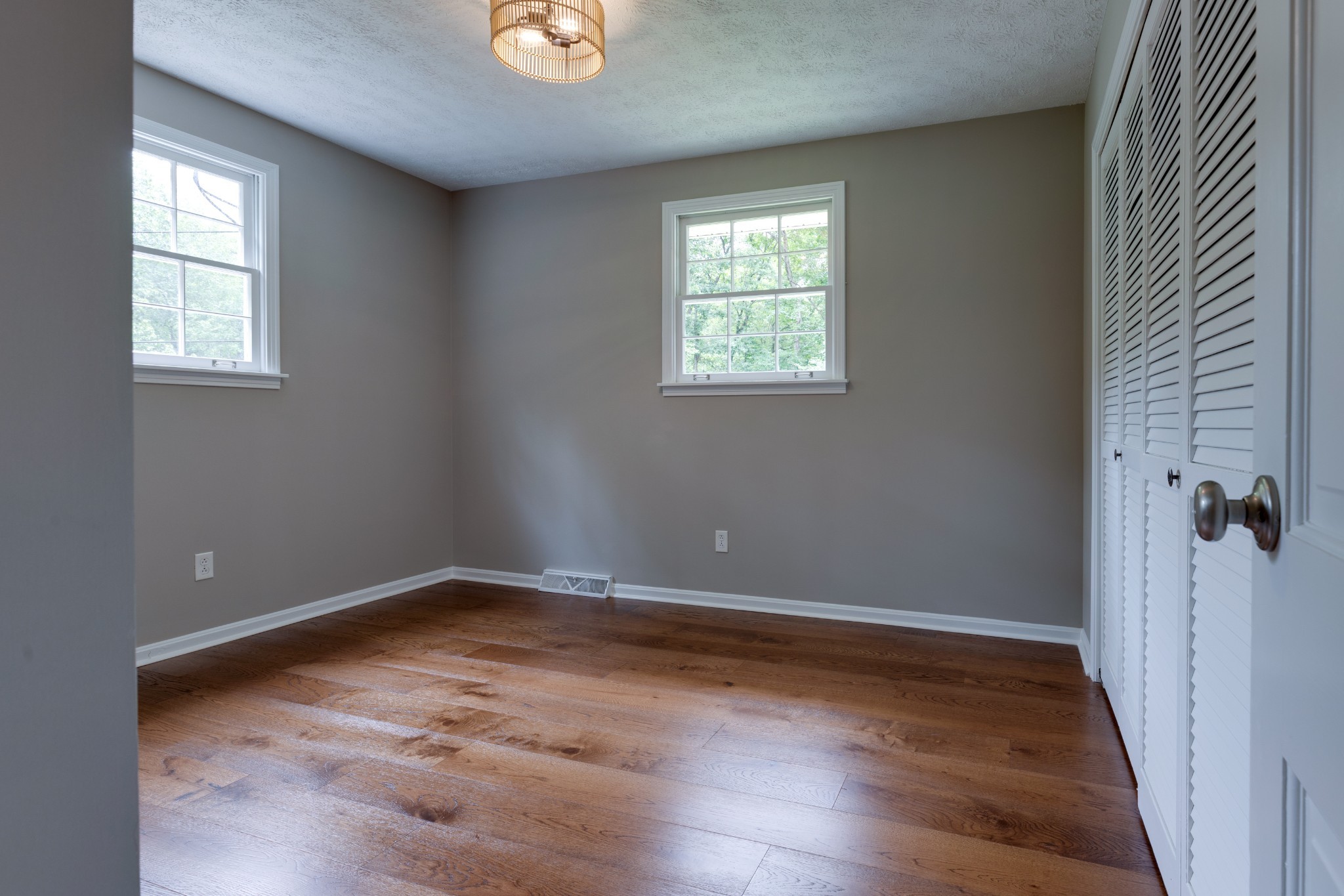 112 Lee Road Dickson, TN 37055 - Photo 23 of 39 an empty room with wooden floor and windows