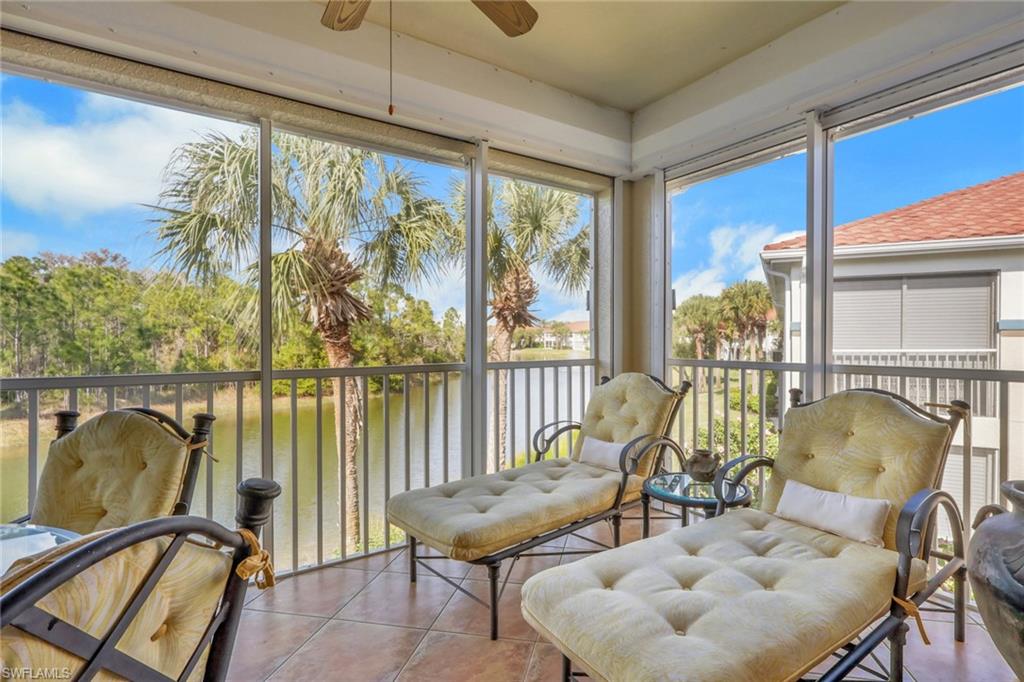 10801 Crooked River Road, Unit 203 Estero, FL 34135 - Photo 26 of 27 a view of a balcony with furniture and floor to ceiling window