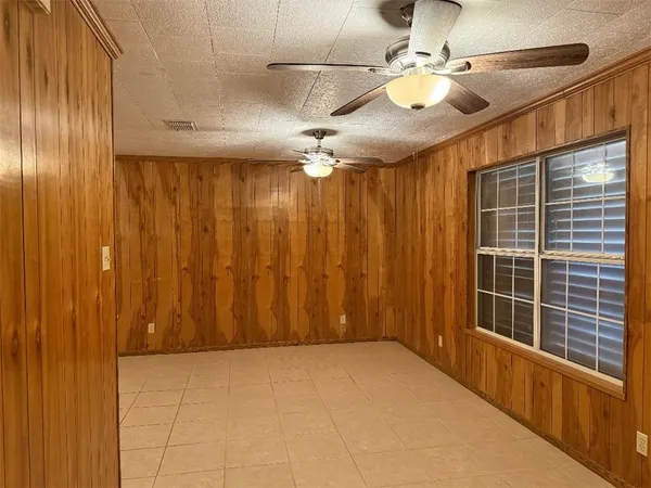 a view of a livingroom with a ceiling fan and a window
