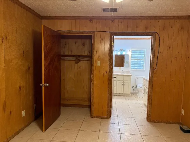 a bathroom with a shower and a sink