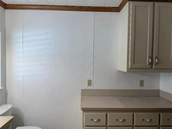 a view of cabinets and wooden floor