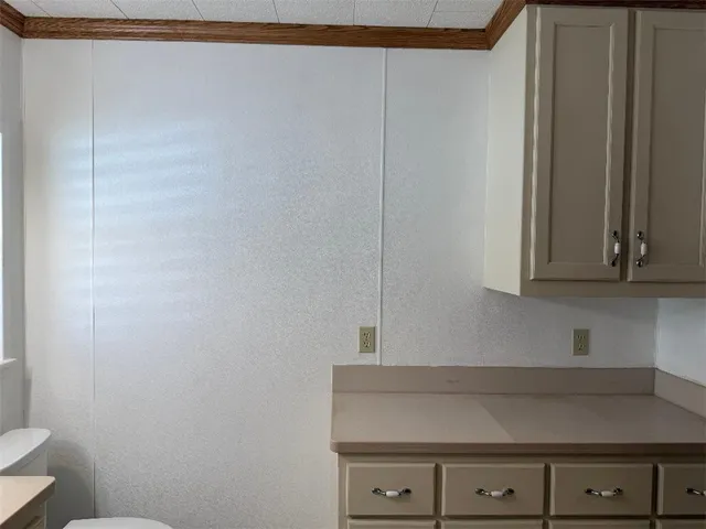 a view of cabinets and wooden floor