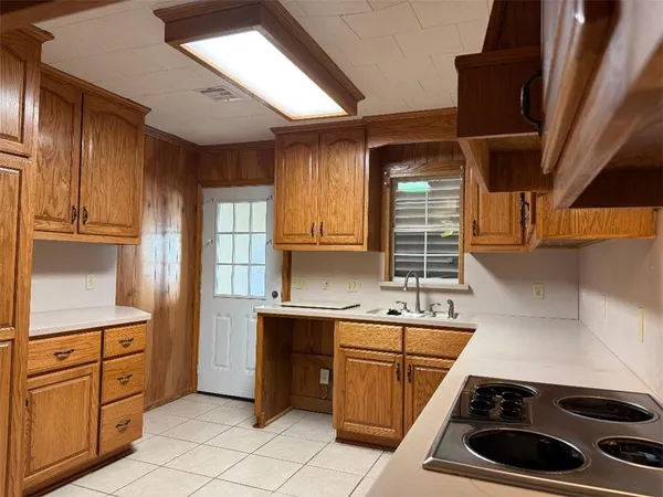 a kitchen with a stove and a sink