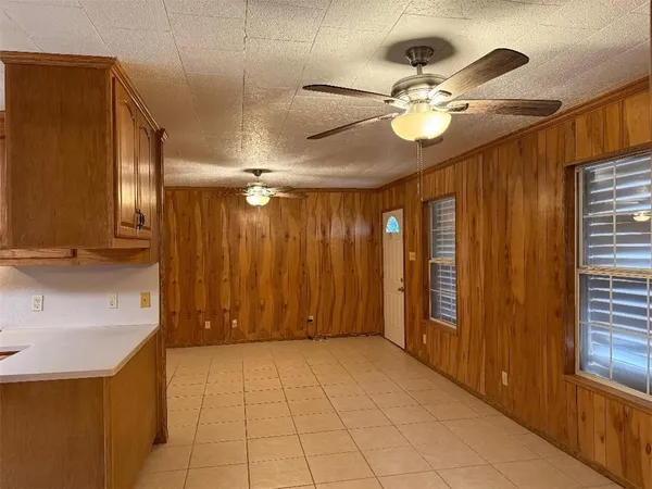 a view of an entryway with a chandelier fan