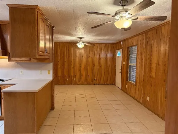 a view of a livingroom with a chandelier fan