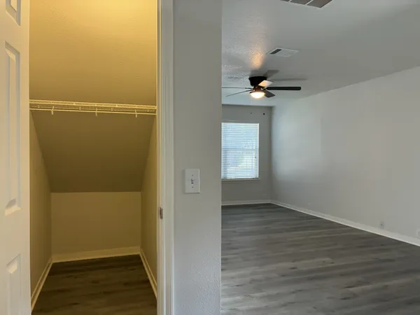 a room with a rug and a window