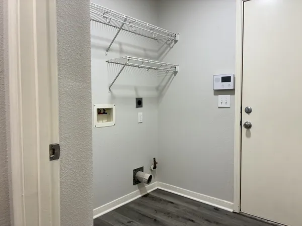 a view of an empty room with a fireplace