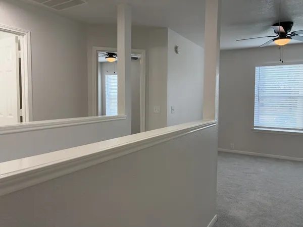 a view of a small space with a fan