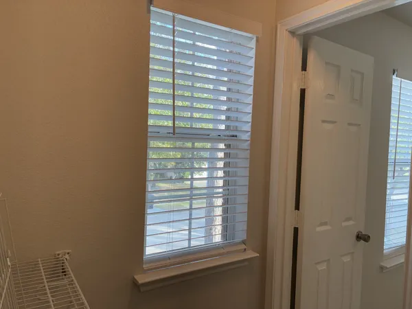 a view of empty room with sliding door and mountain view