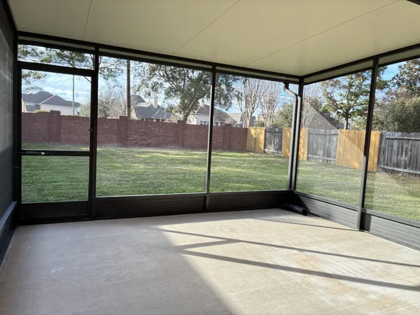 a view of a yard with a tree