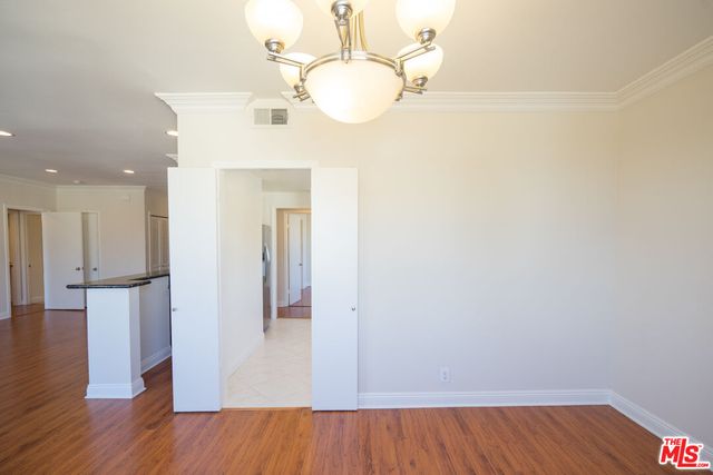 wooden floor in an empty room and a mirror
