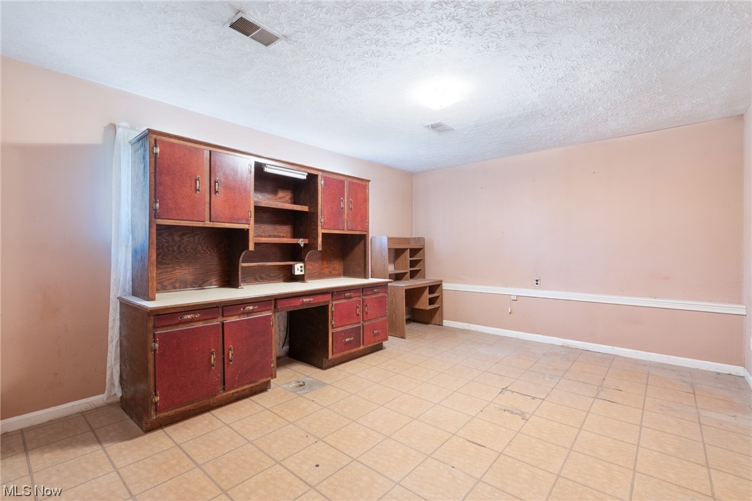 6038 Tippecanoe Road Canfield, OH 44406 - Photo 22 of 34 Office area featuring light tile flooring and a textured ceiling
