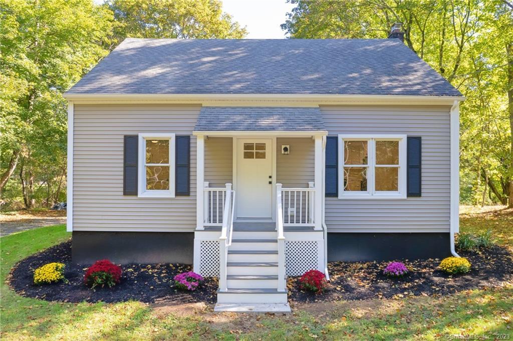 955 Durham Road Wallingford, CT 06492 - Photo 1 of 1 a front view of a house with a yard and a garage