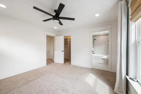 a view of an empty room and fire place