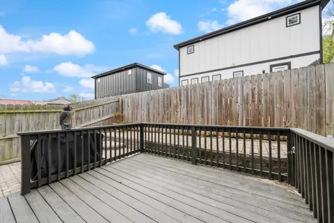 a balcony with wooden floor