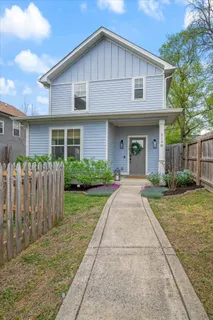 a front view of a house with yard