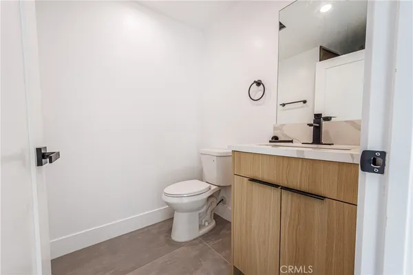 a bathroom with a sink toilet and vanity