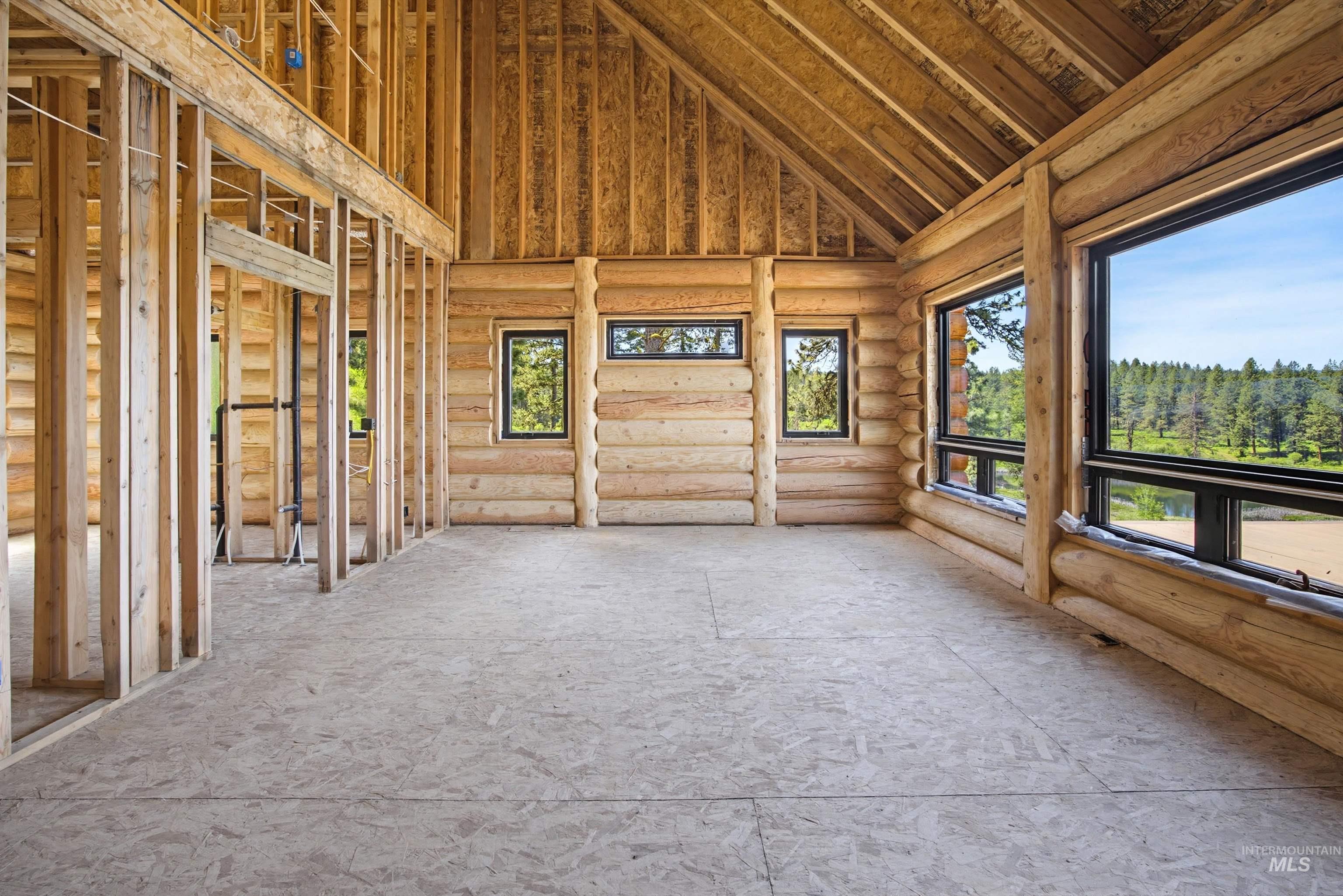 3322 Big Creek Road New Meadows, ID 83654 - Photo 39 of 50 Interior framing showcasing exposed wood log walls and an open-concept structure
