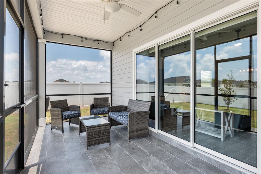 5688 Southwest 92nd Place Ocala, FL 34476 - Photo 47 of 54 a living room with furniture and a large window