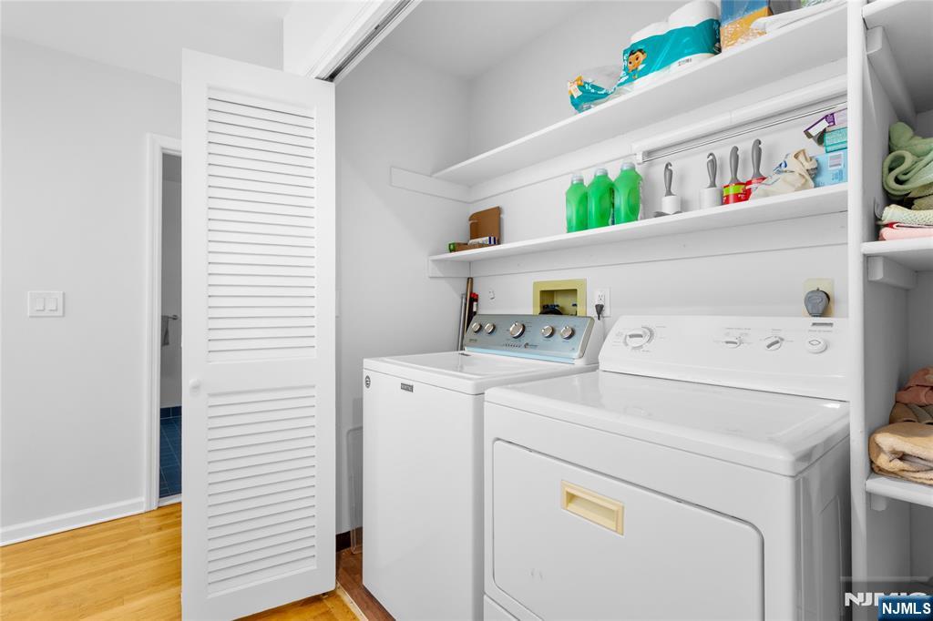 55 Hidden Ledge Road Englewood, NJ 07631 - Photo 17 of 22 a utility room with dryer and washer