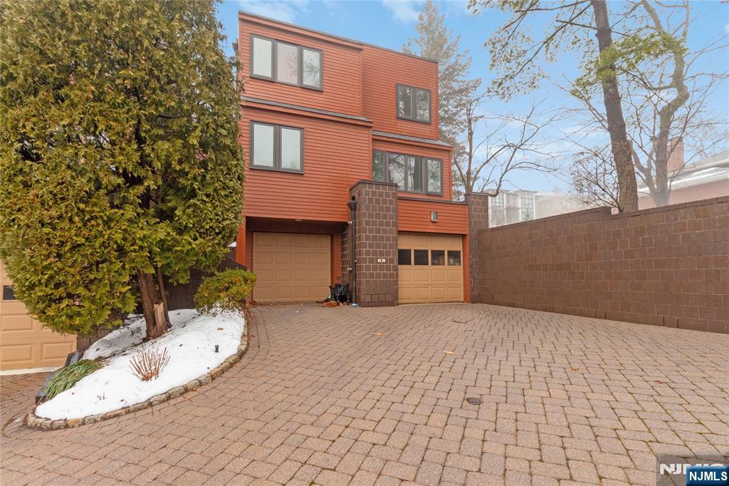 55 Hidden Ledge Road Englewood, NJ 07631 - Photo 2 of 22 a view of a house with a yard