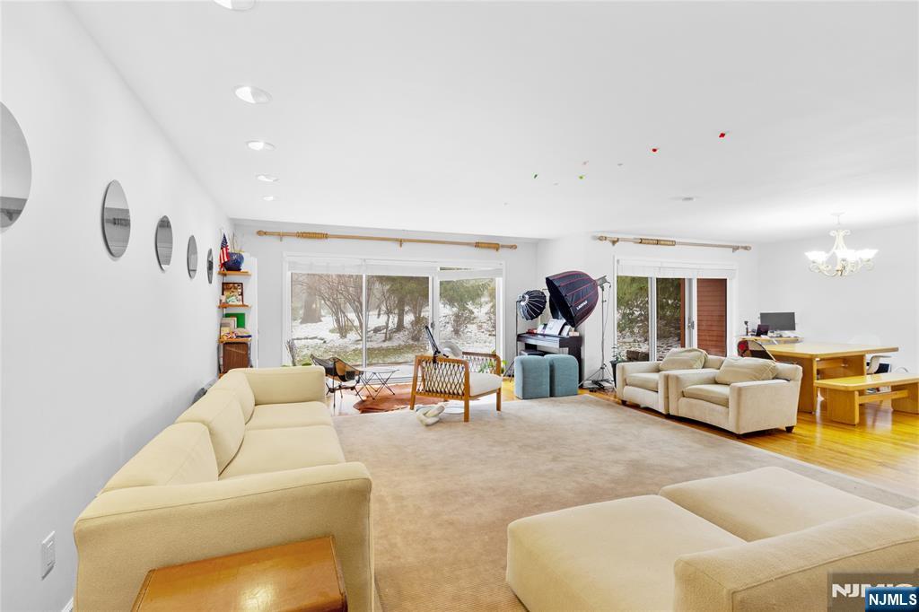 55 Hidden Ledge Road Englewood, NJ 07631 - Photo 3 of 22 a living room with furniture and a large window