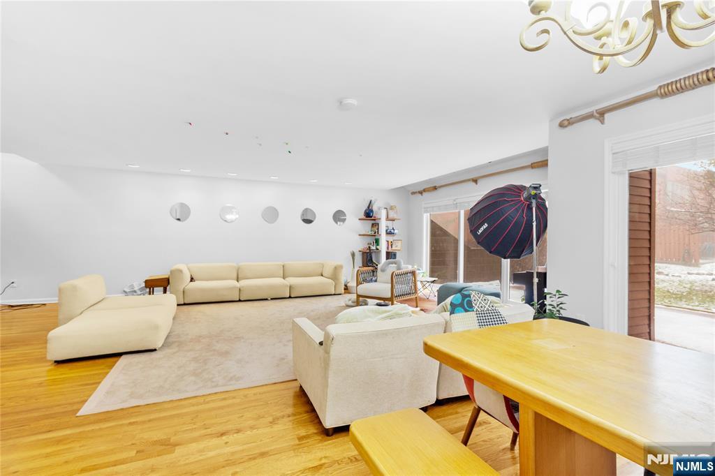 55 Hidden Ledge Road Englewood, NJ 07631 - Photo 4 of 22 a living room with furniture and a large window
