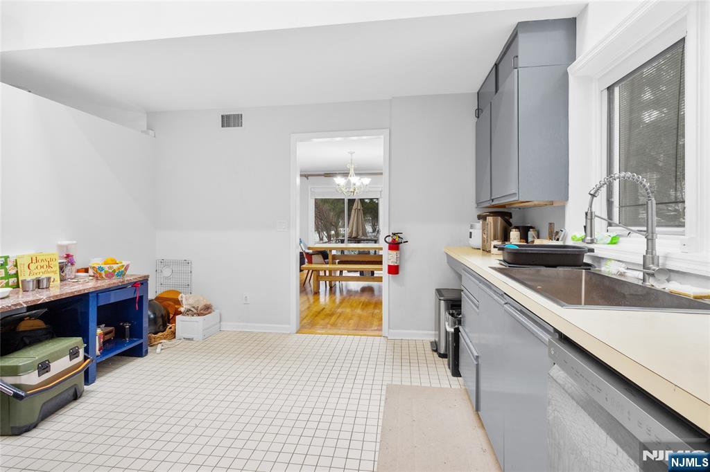 55 Hidden Ledge Road Englewood, NJ 07631 - Photo 7 of 22 a kitchen with a sink and cabinets