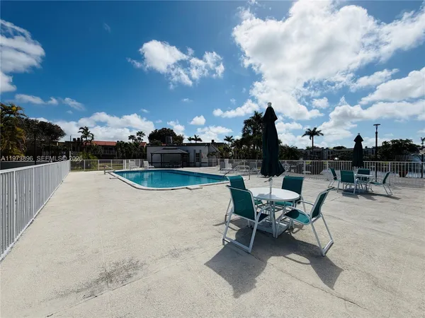 a view of a livingroom with furniture and windows